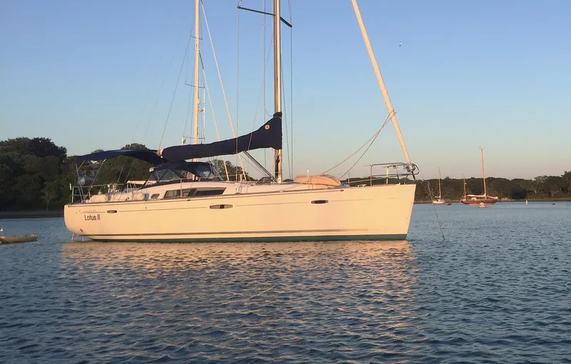 The Image of 2007 Beneteau Oceanis 46 sailboat on calm water at sunset. - 0