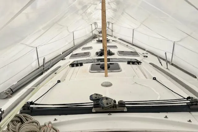 Slide: The Image of 2007 Beneteau Oceanis 46 sailboat deck under protective cover. - 13