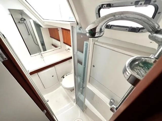 Slide: The Image of Bathroom interior of 2007 Beneteau Oceanis 46 yacht, featuring shower and sink. - 29