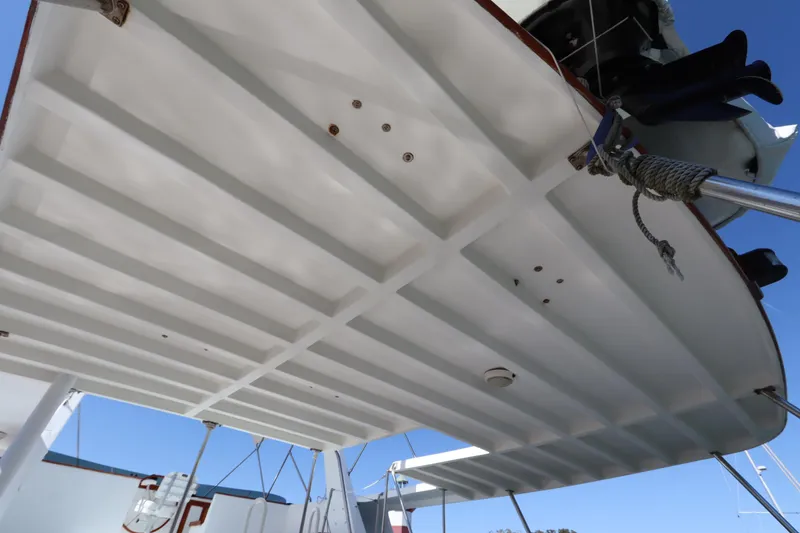 Slide: The Image of 1985 DeFever 44 Trawler deck view, showcasing structural details and rigging. - 15