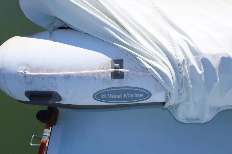 Slide: The Image of Inflatable boat with West Marine logo on DeFever 44 Trawler, 1985 model. - 23