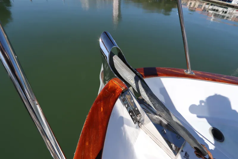 Slide: The Image of Bow of 1985 DeFever 44 Trawler with polished metal fittings and wooden trim. - 25