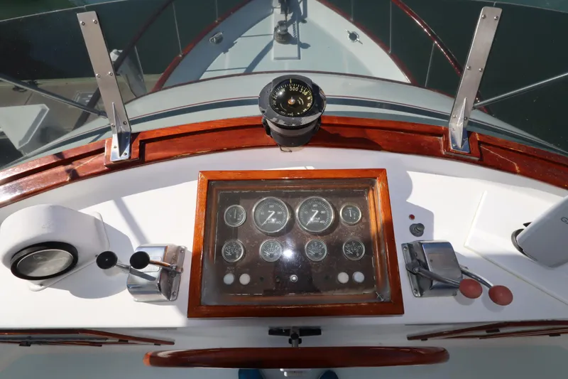Slide: The Image of 1985 DeFever 44 Trawler helm with compass and control panel. - 34