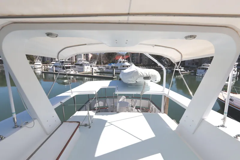 Slide: The Image of 1985 DeFever 44 Trawler yacht deck view at marina. - 42