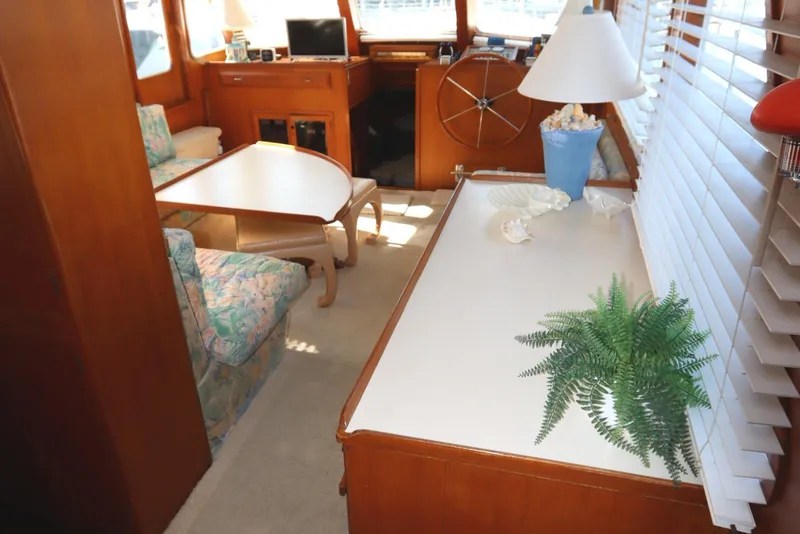Slide: The Image of Interior of 1985 DeFever 44 Trawler with cozy seating and nautical decor. - 47