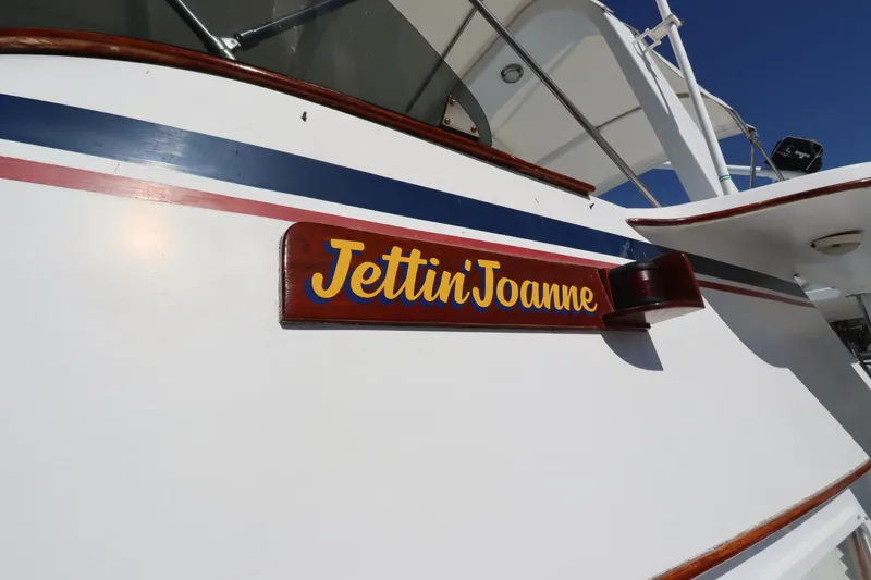 Slide: The Image of 1985 DeFever 44 Trawler with "Jettin Joanne" nameplate, white hull, and blue stripe. - 6