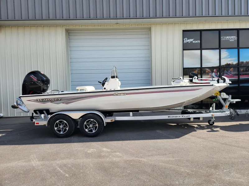 The Image of 2025 Ranger RB200 boat on trailer outside a building. - 0