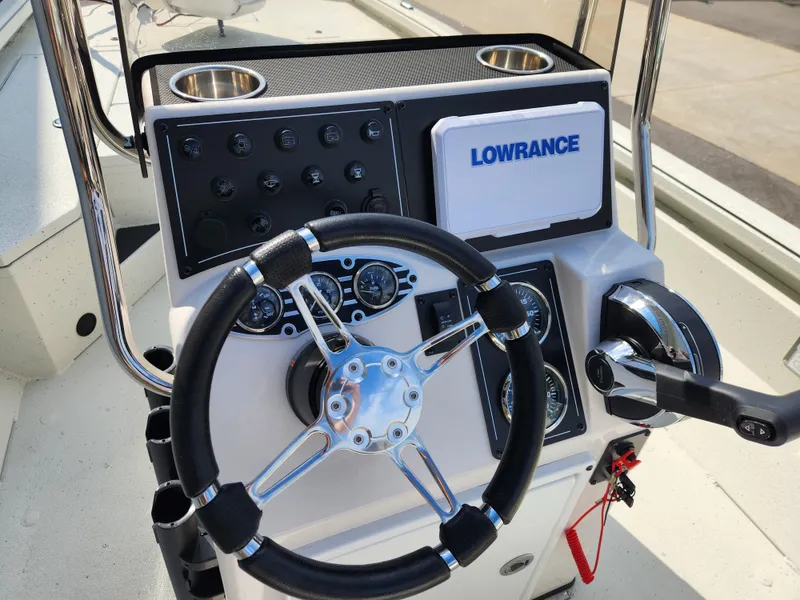 Slide: The Image of Steering console of 2025 Ranger RB200 boat with Lowrance electronics and control panel. - 10