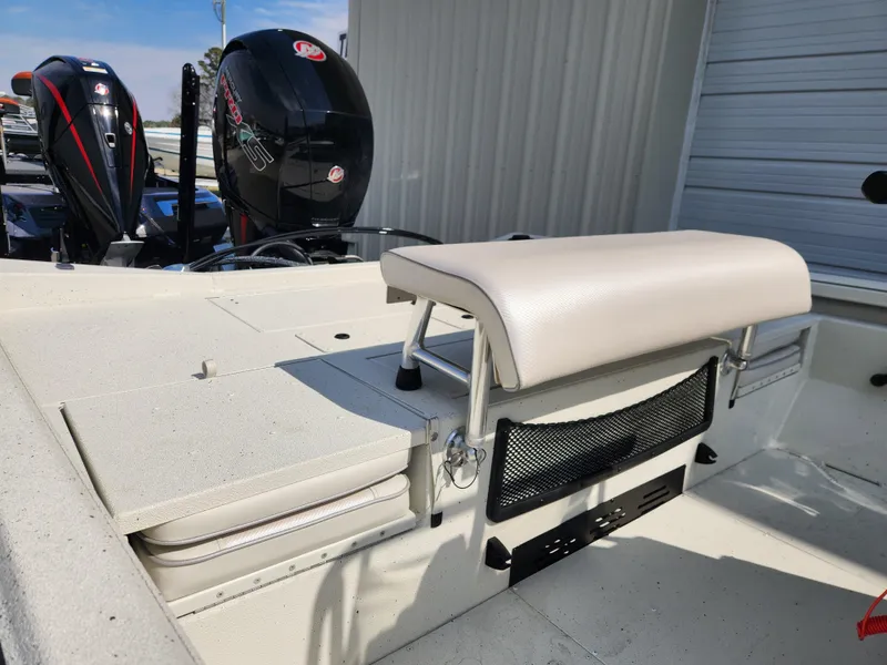 Slide: The Image of 2025 Ranger RB200 boat interior with seating and dual outboard motors. - 12