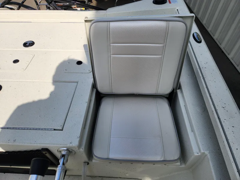 Slide: The Image of 2025 Ranger RB200 boat seat with white upholstery and storage compartment. - 14