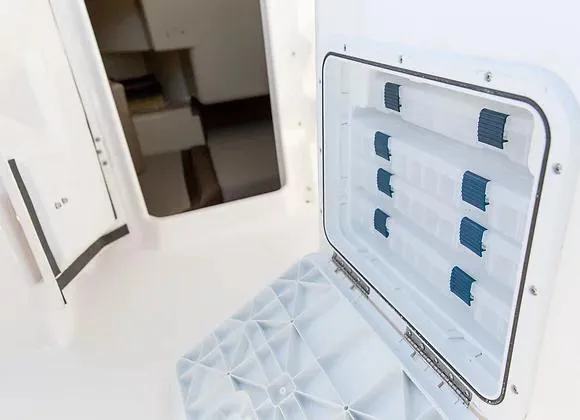Slide: The Image of Open storage compartment on 2025 Solara 250 Center Walkaround boat. - 12