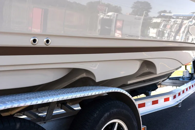 Slide: The Image of 2025 Solara 250 Center Walkaround boat on trailer, showcasing sleek hull design. - 16