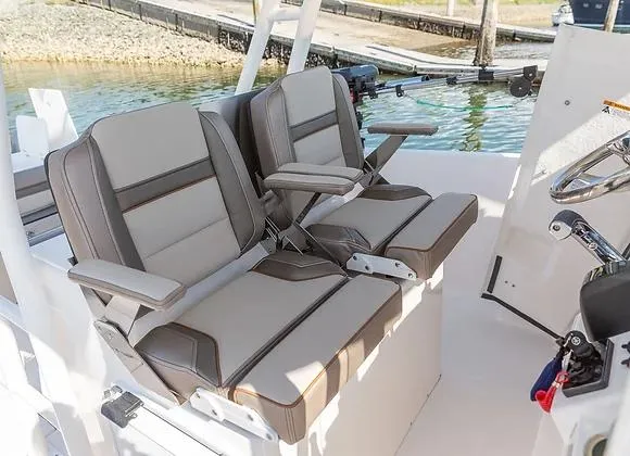 Slide: The Image of 2025 Solara 250 Center Walkaround boat seats, featuring comfortable, modern design near water. - 4