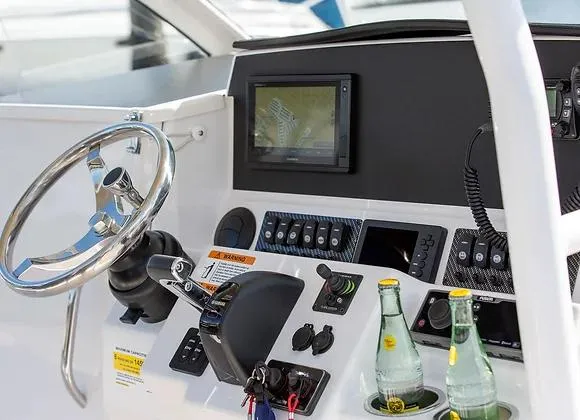 Slide: The Image of 2025 Solara 250 Center Walkaround helm with steering wheel, controls, and navigation display. - 5