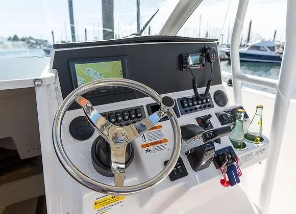 Slide: The Image of Helm of 2025 Solara 250 Center Walkaround with steering wheel and navigation controls. - 6