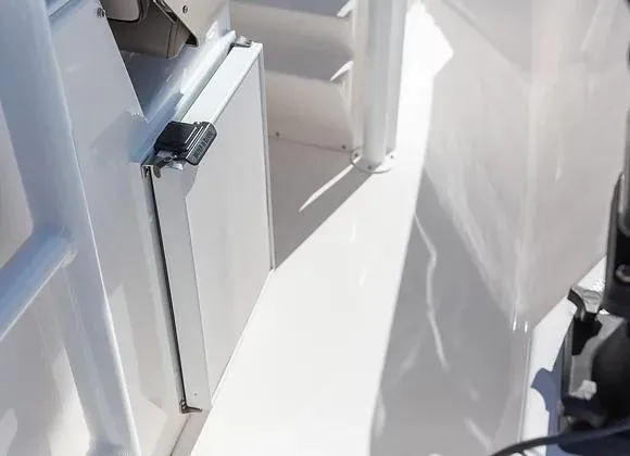 Slide: The Image of 2025 Solara 250 Center Walkaround boat interior with sleek white finish and compact storage. - 9