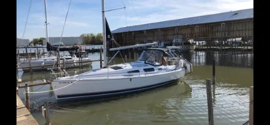 The Image of Sailboat docked in marina, 2005 Hunter 33 model, calm water, sunny day. - 0
