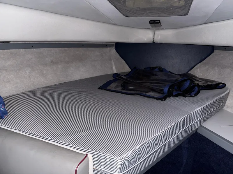 Slide: The Image of 1988 Formula 29 PC cabin interior with striped mattress and storage space. - 14