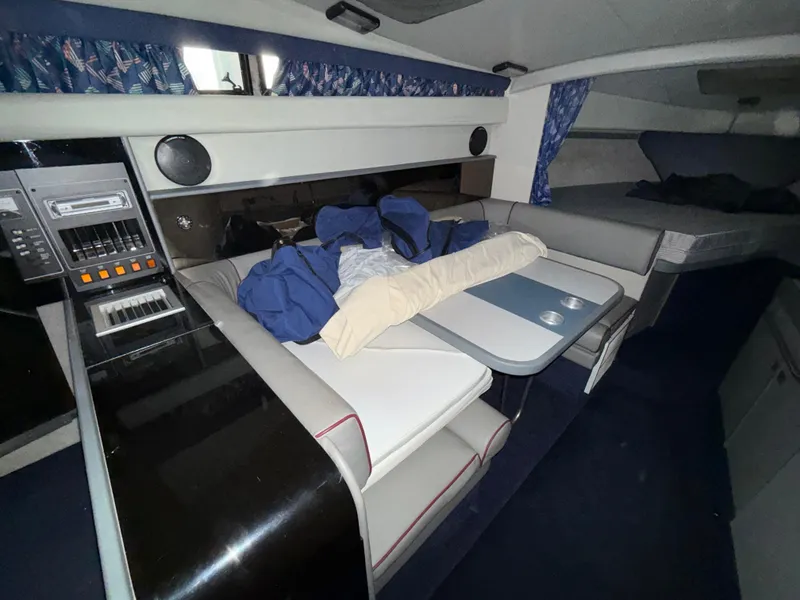 Slide: The Image of Interior of 1988 Formula 29 PC boat with seating, table, and audio system. - 19
