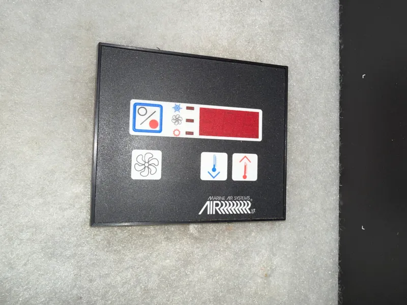 Slide: The Image of Control panel of a 1988 Formula 29 PC boat's air system, featuring fan and temperature icons. - 20