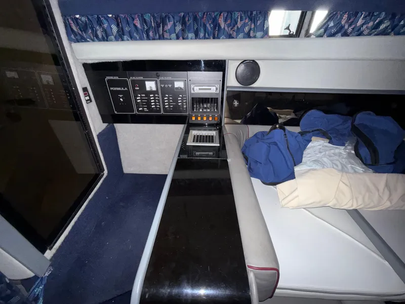 Slide: The Image of 1988 Formula 29 PC cabin interior with control panel and bedding. - 24