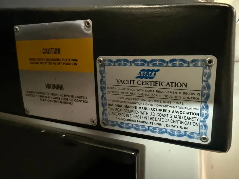Slide: The Image of Caution and yacht certification labels on a 1988 Formula 29 PC boat. - 25
