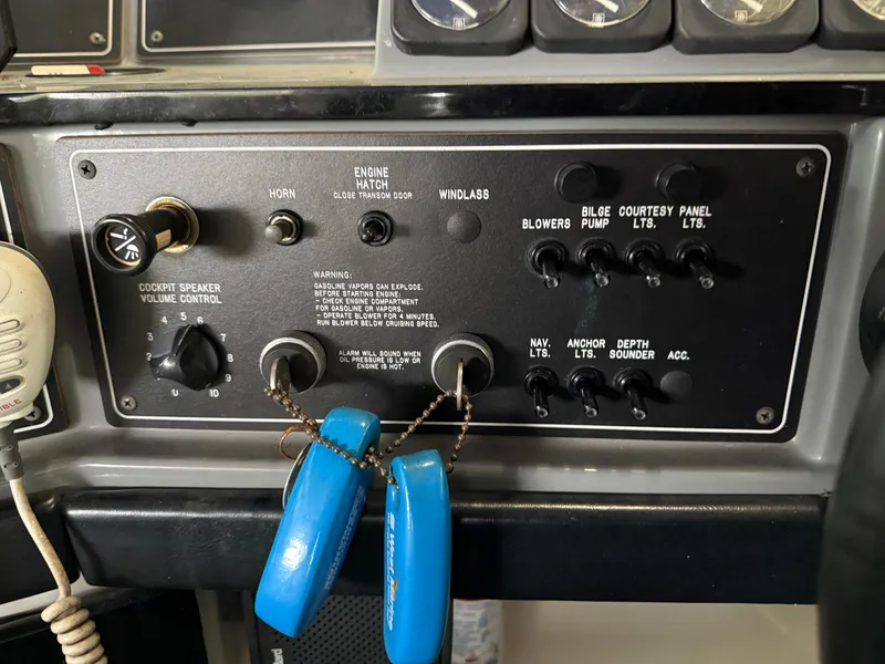 Slide: The Image of Control panel of a 1988 Formula 29 PC boat with various switches and keys. - 28