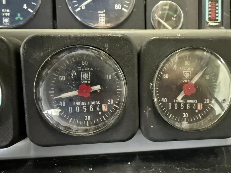 Slide: The Image of Close-up of 1988 Formula 29 PC engine hour meters displaying 564 hours. - 31