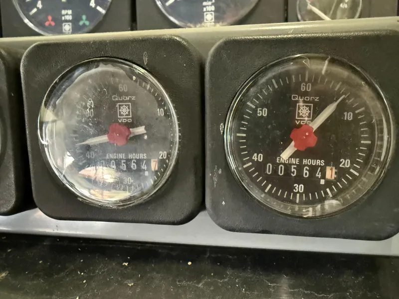 Slide: The Image of Close-up of 1988 Formula 29 PC engine hour meters displaying 564 hours. - 33