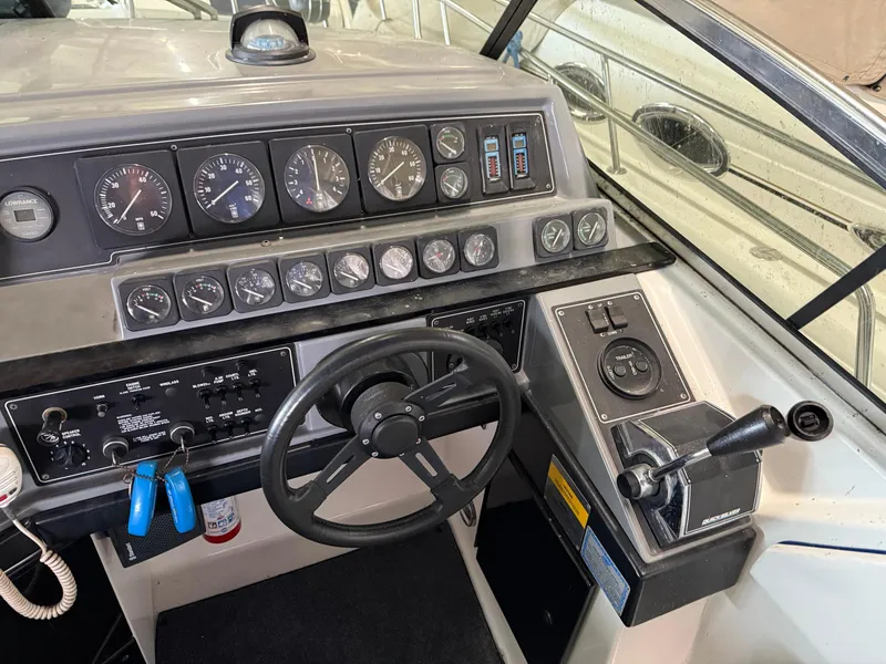 Slide: The Image of 1988 Formula 29 PC boat dashboard with steering wheel and instrument panel. - 34