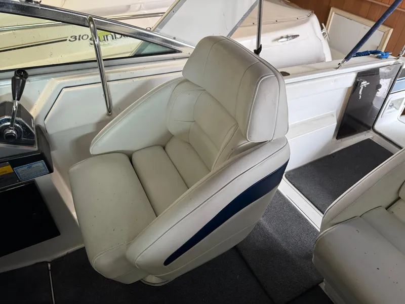 Slide: The Image of 1988 Formula 29 PC boat interior with white captain's chair and control panel. - 35