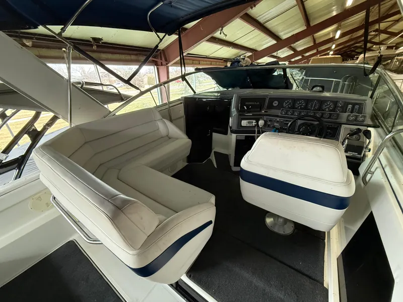 Slide: The Image of 1988 Formula 29 PC boat interior with seating and swim platform ladder. - 4