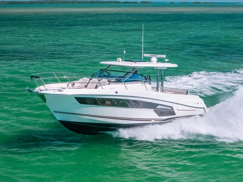 The Image of 2021 Jeanneau Leader 12.5 WA cruising on vibrant turquoise waters. - 0