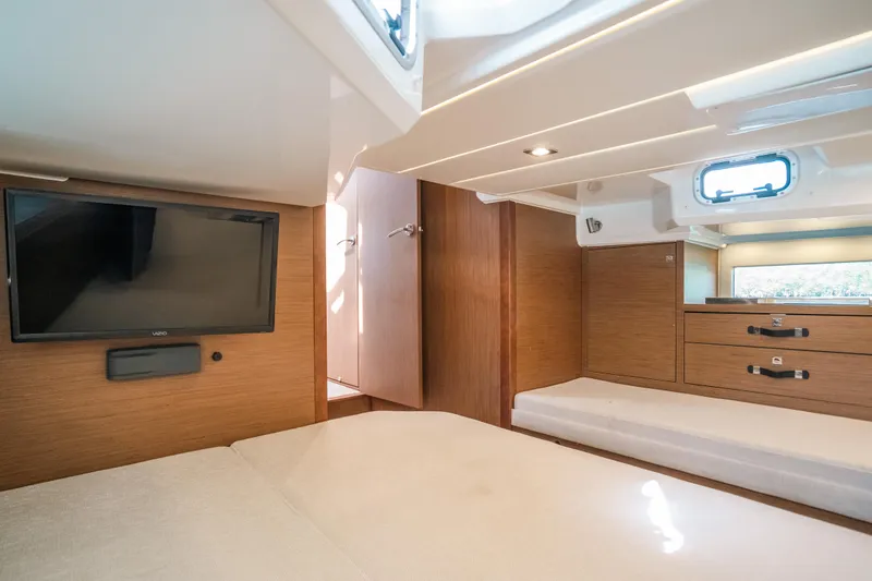 Slide: The Image of Interior cabin of 2021 Jeanneau Leader 12.5 WA with TV and wooden furnishings. - 17