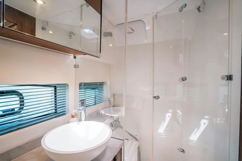 Slide: The Image of Modern bathroom interior on 2021 Jeanneau Leader 12.5 WA yacht with glass shower. - 21