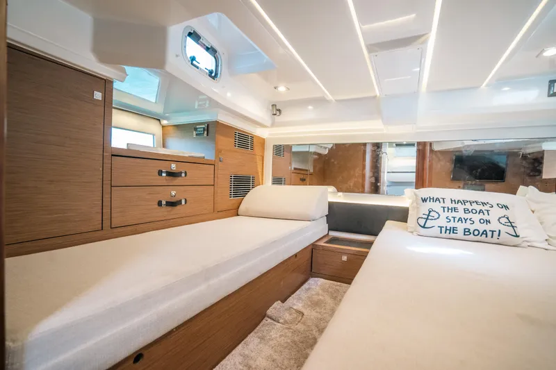 Slide: The Image of Interior of 2021 Jeanneau Leader 12.5 WA boat with cozy cabin and stylish decor. - 22