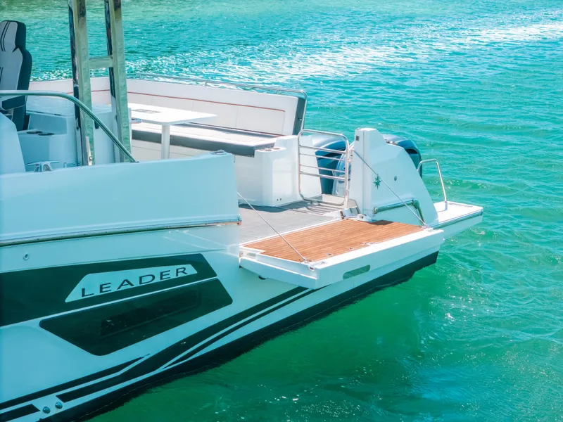 Slide: The Image of 2021 Jeanneau Leader 12.5 WA boat docked on clear turquoise water. - 27