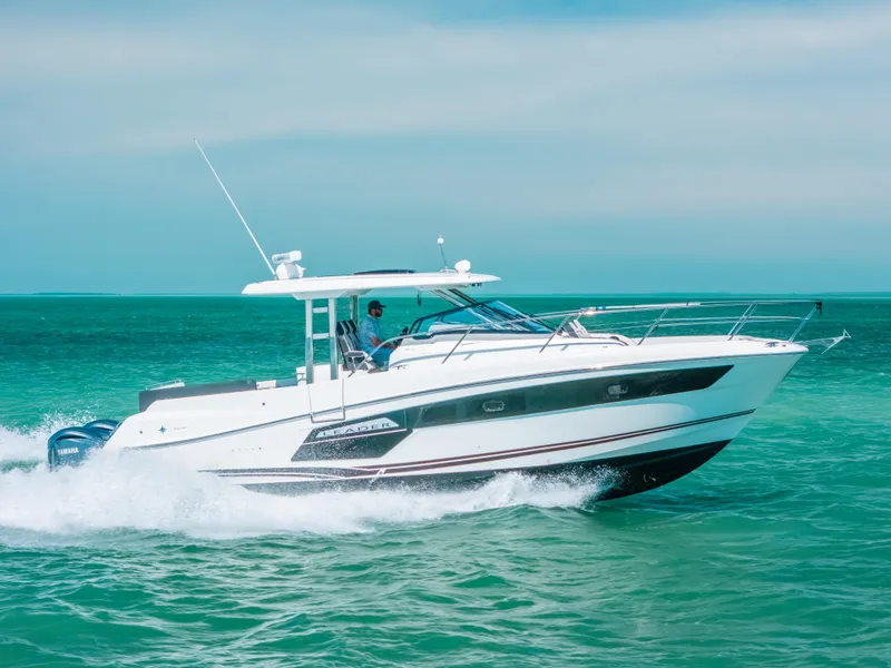 Slide: The Image of 2021 Jeanneau Leader 12.5 WA cruising on turquoise waters. - 28