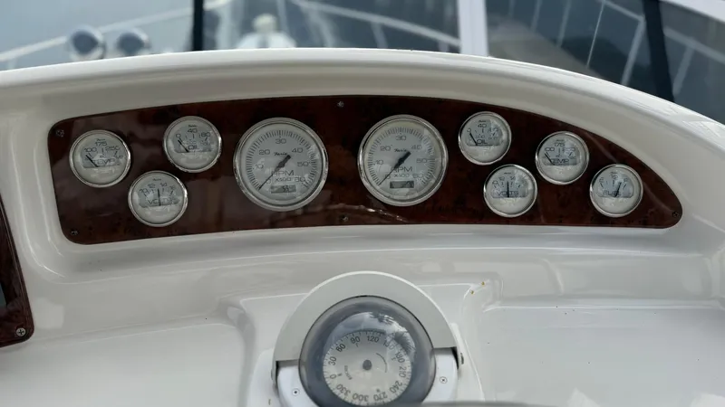 Slide: The Image of Dashboard of 2001 Silverton 410 Sport Bridge with multiple gauges and instruments. - 18