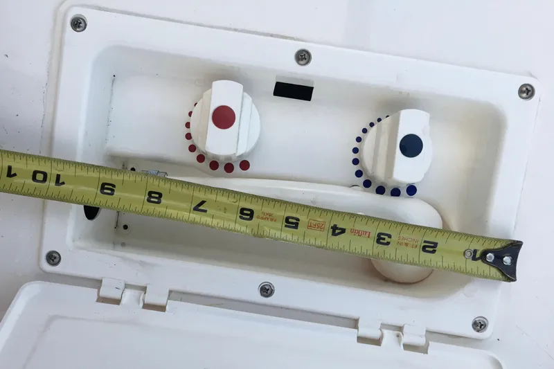 Slide: The Image of Boat control panel with knobs and measuring tape, Silverton 410 Sport Bridge 2001. - 22