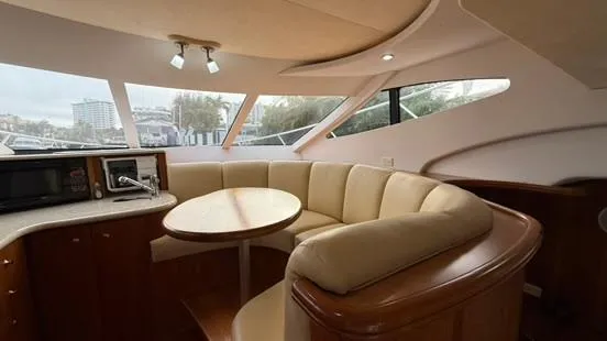 Slide: The Image of Interior of 2001 Silverton 410 Sport Bridge yacht with cozy seating and modern amenities. - 28