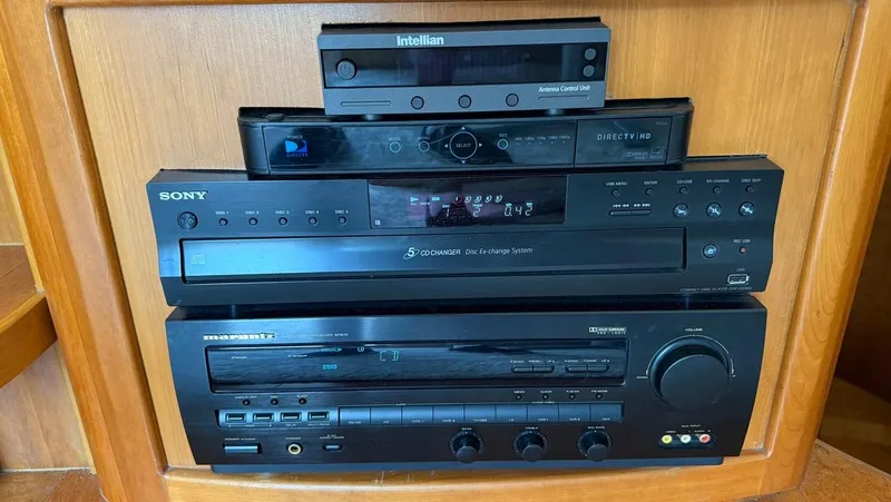 Slide: The Image of Stacked audio and video equipment in a 2001 Silverton 410 Sport Bridge yacht. - 36