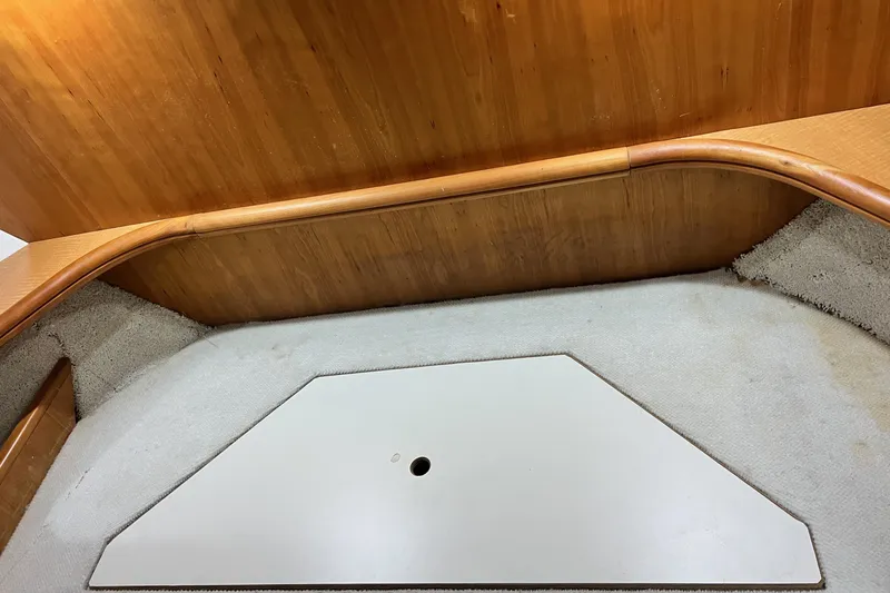 Slide: The Image of Interior view of a 2001 Silverton 410 Sport Bridge, featuring wood paneling and carpeted flooring. - 45