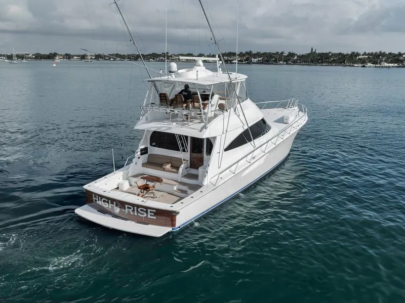 Slide: The Image of 2019 Viking 68 Convertible yacht cruising on calm waters. - 11