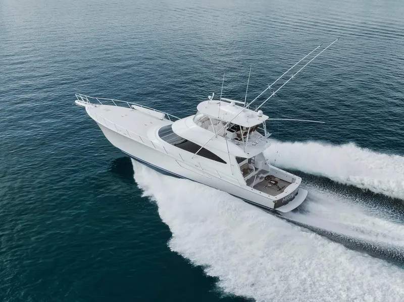 Slide: The Image of 2019 Viking 68 Convertible yacht cruising on open water, aerial view. - 12