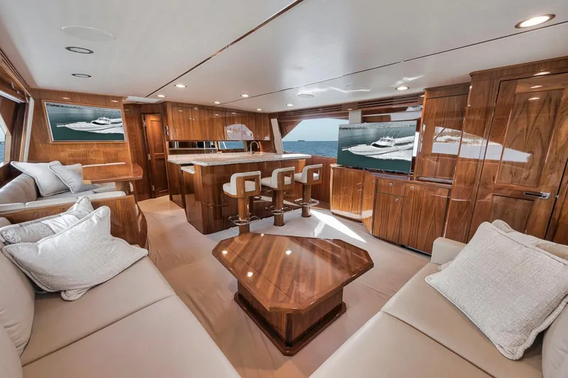 Slide: The Image of Luxurious interior of 2019 Viking 68 Convertible yacht with elegant wood finishes and plush seating. - 18