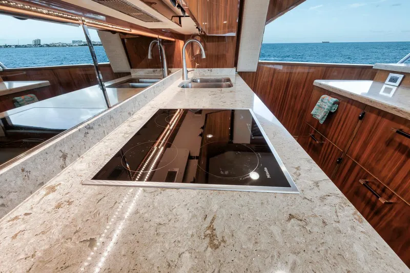 Slide: The Image of Luxurious kitchen interior of 2019 Viking 68 Convertible yacht with ocean view. - 24