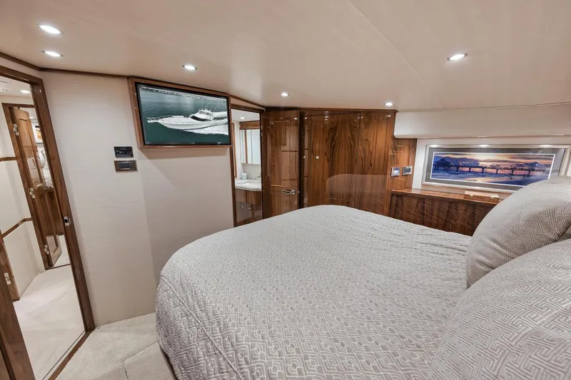 Slide: The Image of Luxurious interior of 2019 Viking 68 Convertible yacht with elegant wood finishes. - 28