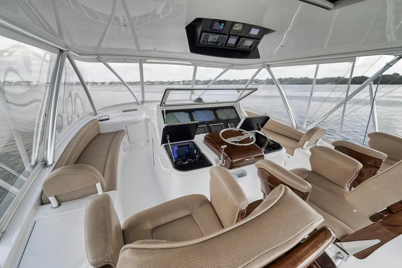 Slide: The Image of Interior of 2019 Viking 68 Convertible yacht with modern helm and seating. - 42