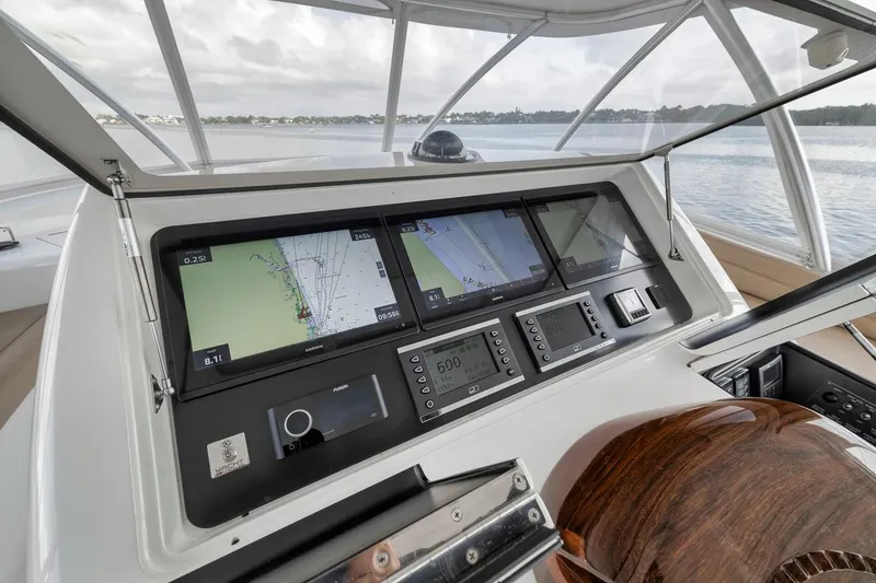 Slide: The Image of Control panel of 2019 Viking 68 Convertible yacht with navigation screens and instruments. - 43